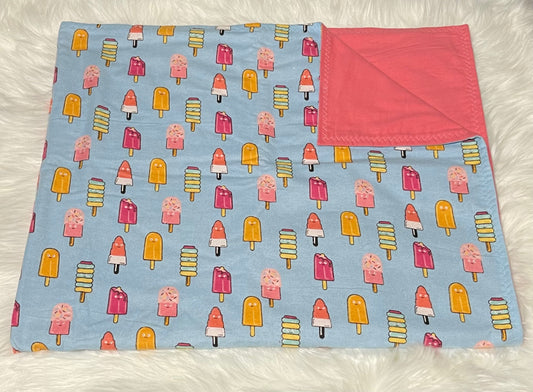 Popsicles on blue toddler blanket