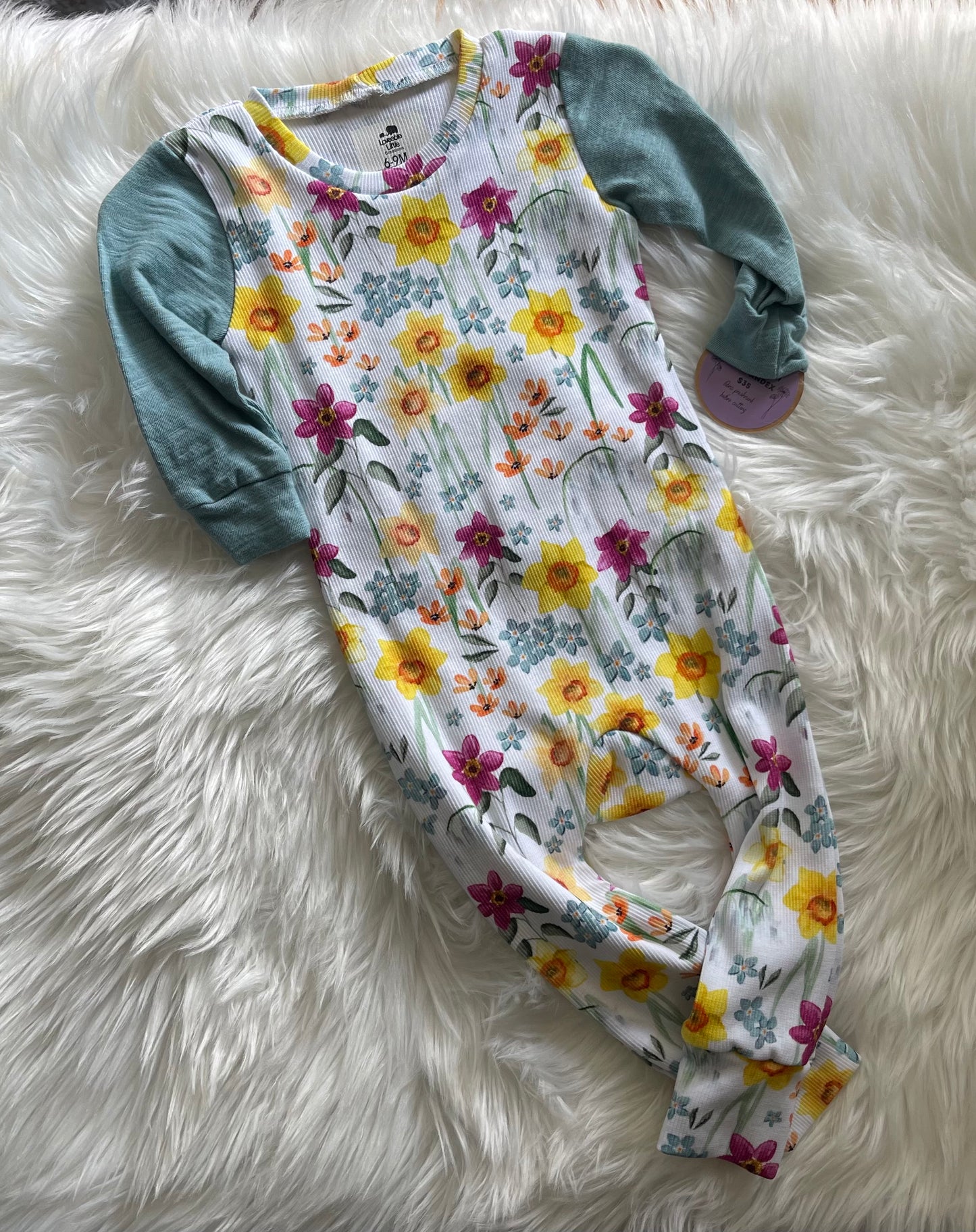 ￼Floral ribbed knit envelope romper